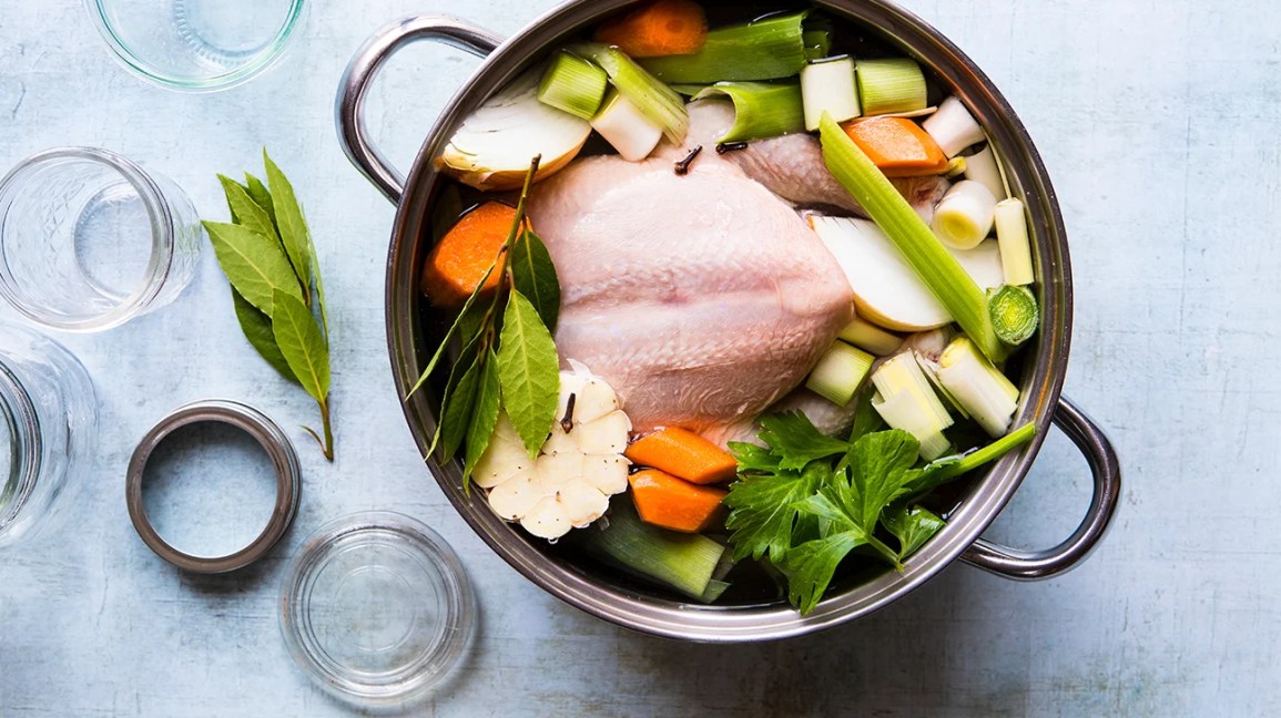 pot of chicken soup with garlic