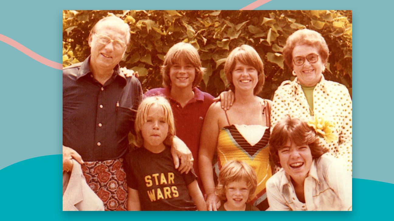 Rob Lowe (back row, left of center) pictured with his family.
