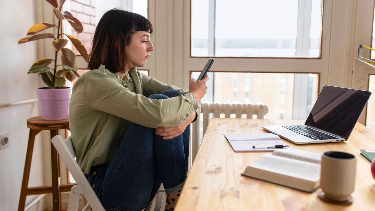 Young woman looking at smartphone.